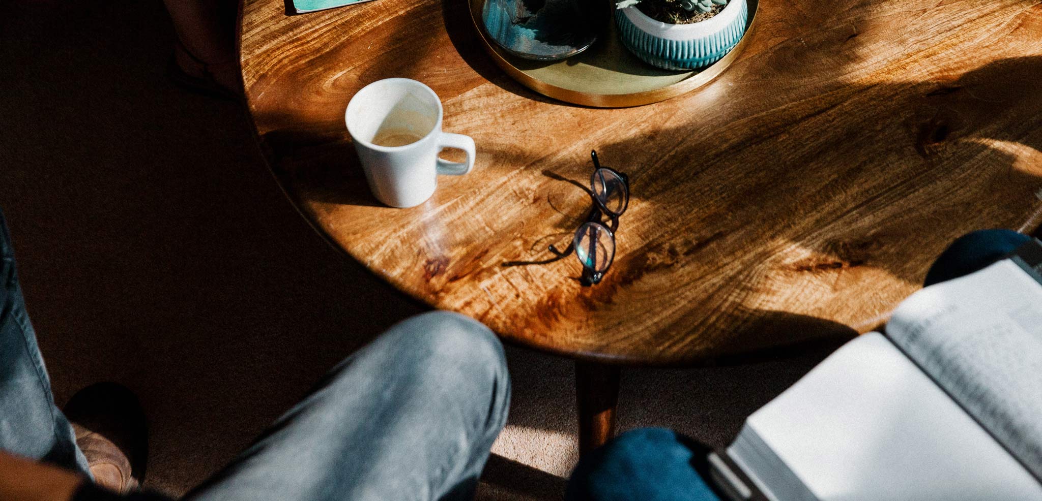 Coffee table with a coffee and glasses on it
